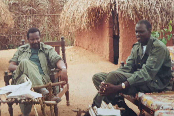 SOMALIA, Mogadishu: In a photograph dated 4 February and released by the African Union-United Nations Information Support team 5 February, Brigadier Paul Lokech, Ugandan Contingent Commander serving with the African Union Mission in Somalia (AMISOM), hands out free mosquito nets to Somali civilians ina compound where Uganan doctors were providing free medical check-ups and treatment in the Kaaran district of the Somali capital Mogadishu. The free medical care and distribution of mosquito nets were part of a week-long programme called Tarehe Sita - Swahili for 6 February - which is the commemorative date that the Ugandan People's Defence Force (UPDF) was formed. This year marks 31 years since the UPDF's creation, which currently has around 6,500 personnel serving with AMISOM in Somalia. AU-UN IST PHOTO / STUART PRICE.