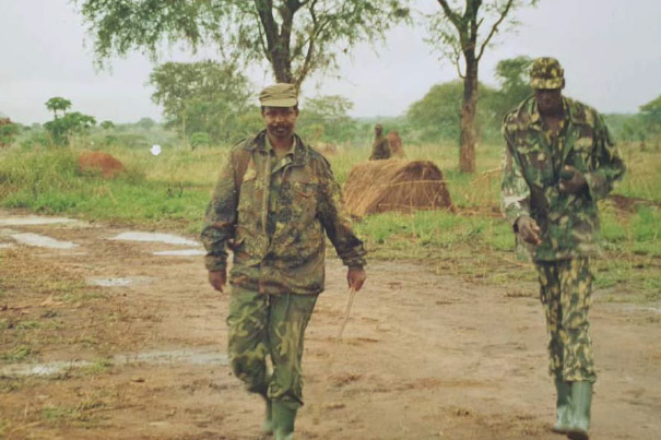 SOMALIA, Mogadishu: In a photograph dated 4 February and released by the African Union-United Nations Information Support team 5 February, Brigadier Paul Lokech, Ugandan Contingent Commander serving with the African Union Mission in Somalia (AMISOM), hands out free mosquito nets to Somali civilians ina compound where Uganan doctors were providing free medical check-ups and treatment in the Kaaran district of the Somali capital Mogadishu. The free medical care and distribution of mosquito nets were part of a week-long programme called Tarehe Sita - Swahili for 6 February - which is the commemorative date that the Ugandan People's Defence Force (UPDF) was formed. This year marks 31 years since the UPDF's creation, which currently has around 6,500 personnel serving with AMISOM in Somalia. AU-UN IST PHOTO / STUART PRICE.